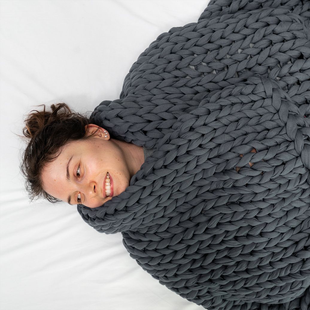 Woman with weighted blanket